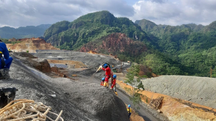 BMP Drill team conducting drilling operations at an open pit mine